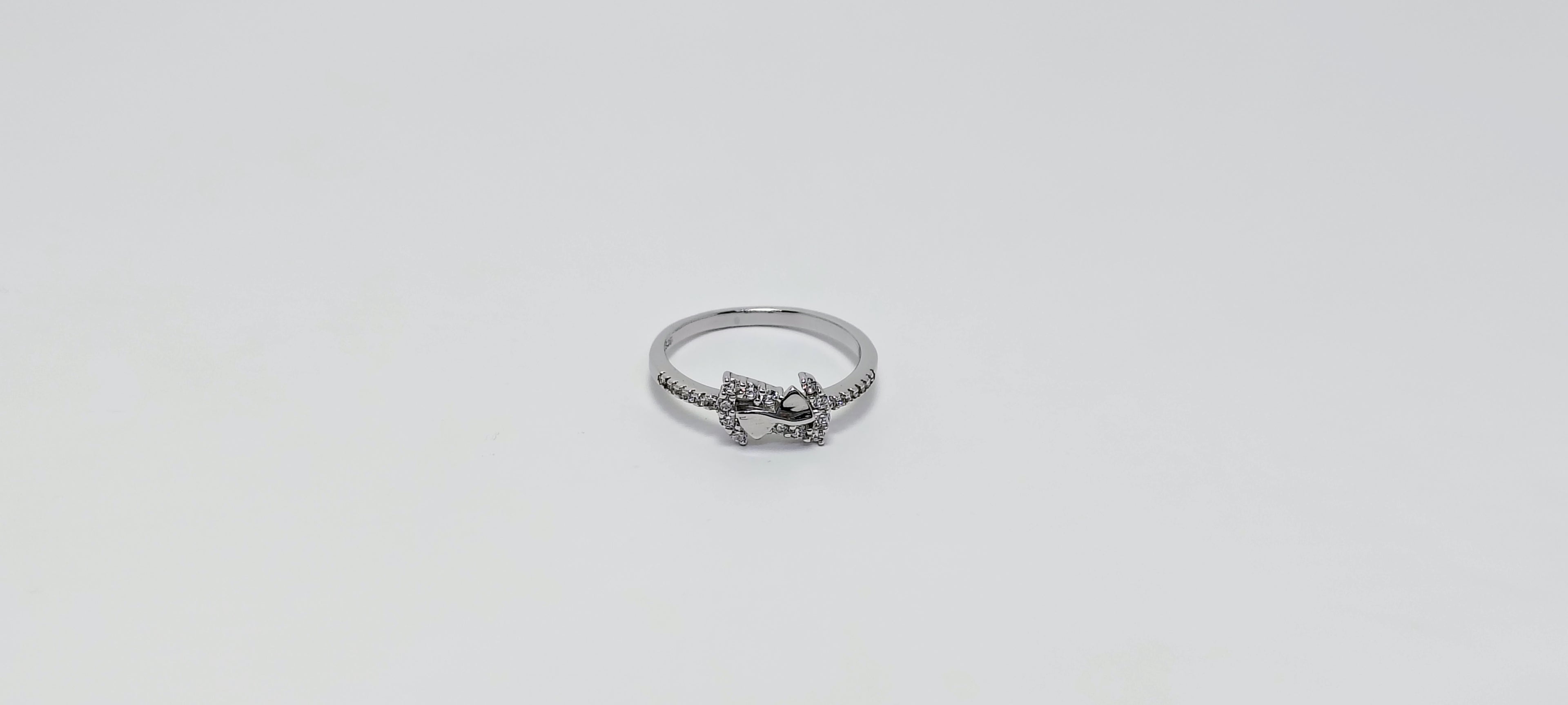 Silver ring with a small heart and star design 