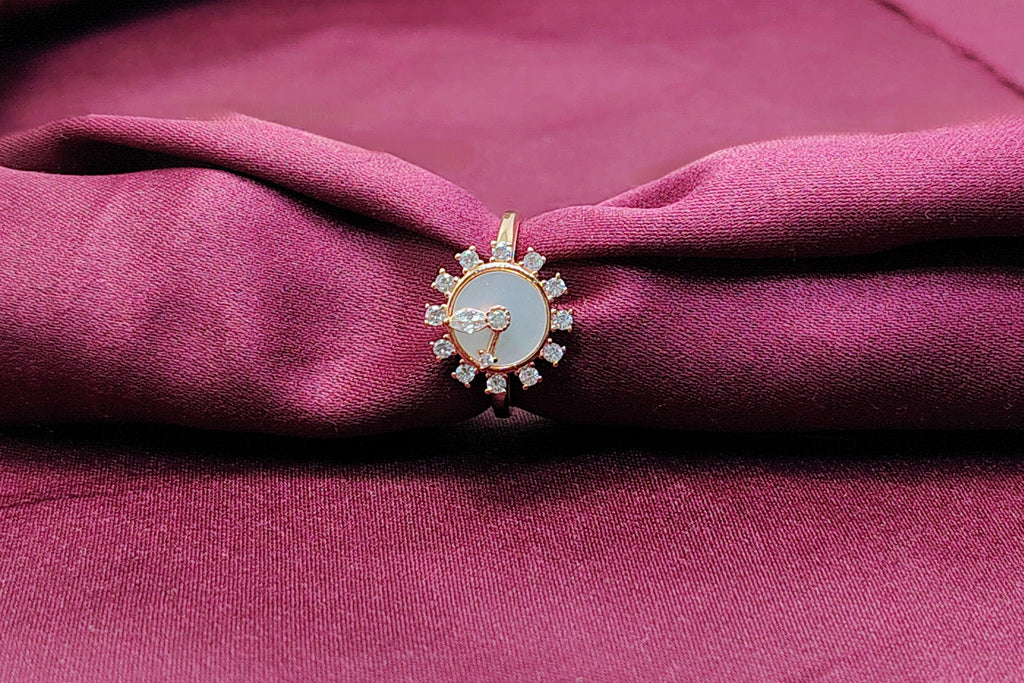 Decorative brooch on a maroon fabric background