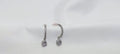 Pair of silver earrings with clear stones