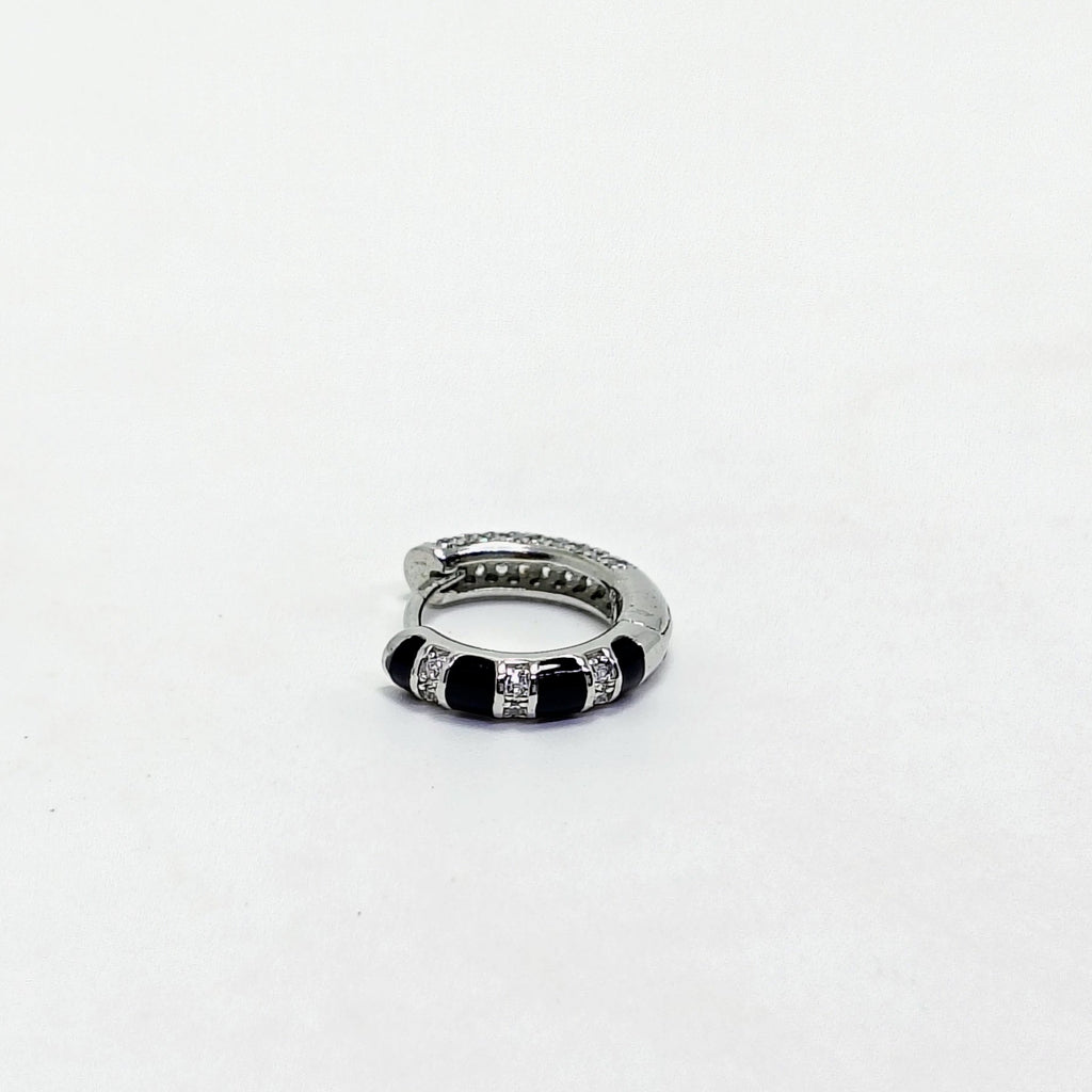 Silver ring with black accents