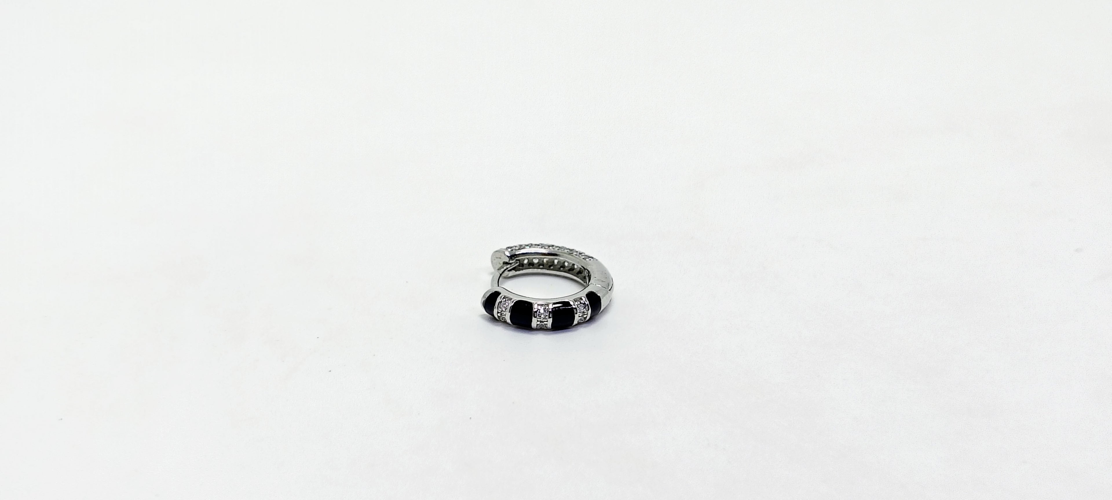 Silver ring with black accents