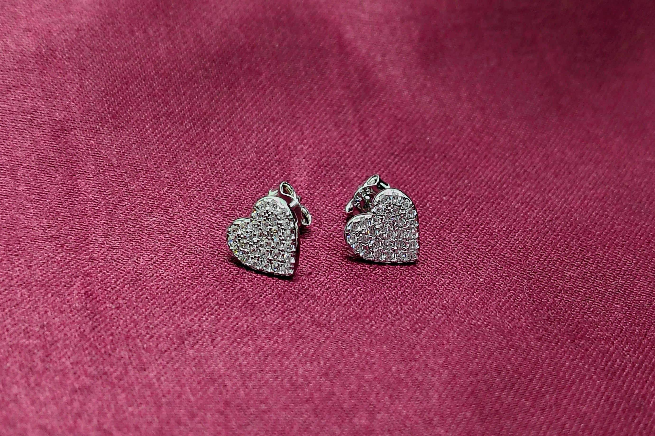 Silver Heart Shape Stud Earrings - Designed to catch the light — and the attention.