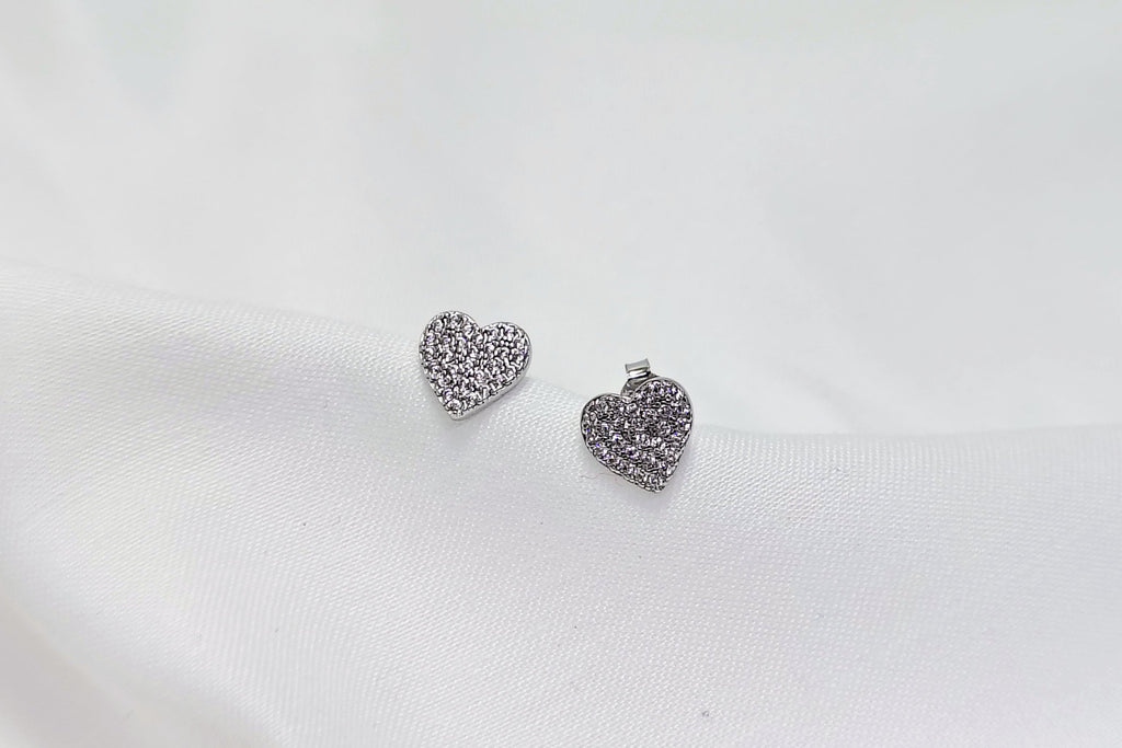 Silver Heart Shape Stud Earrings - Designed to catch the light — and the attention.