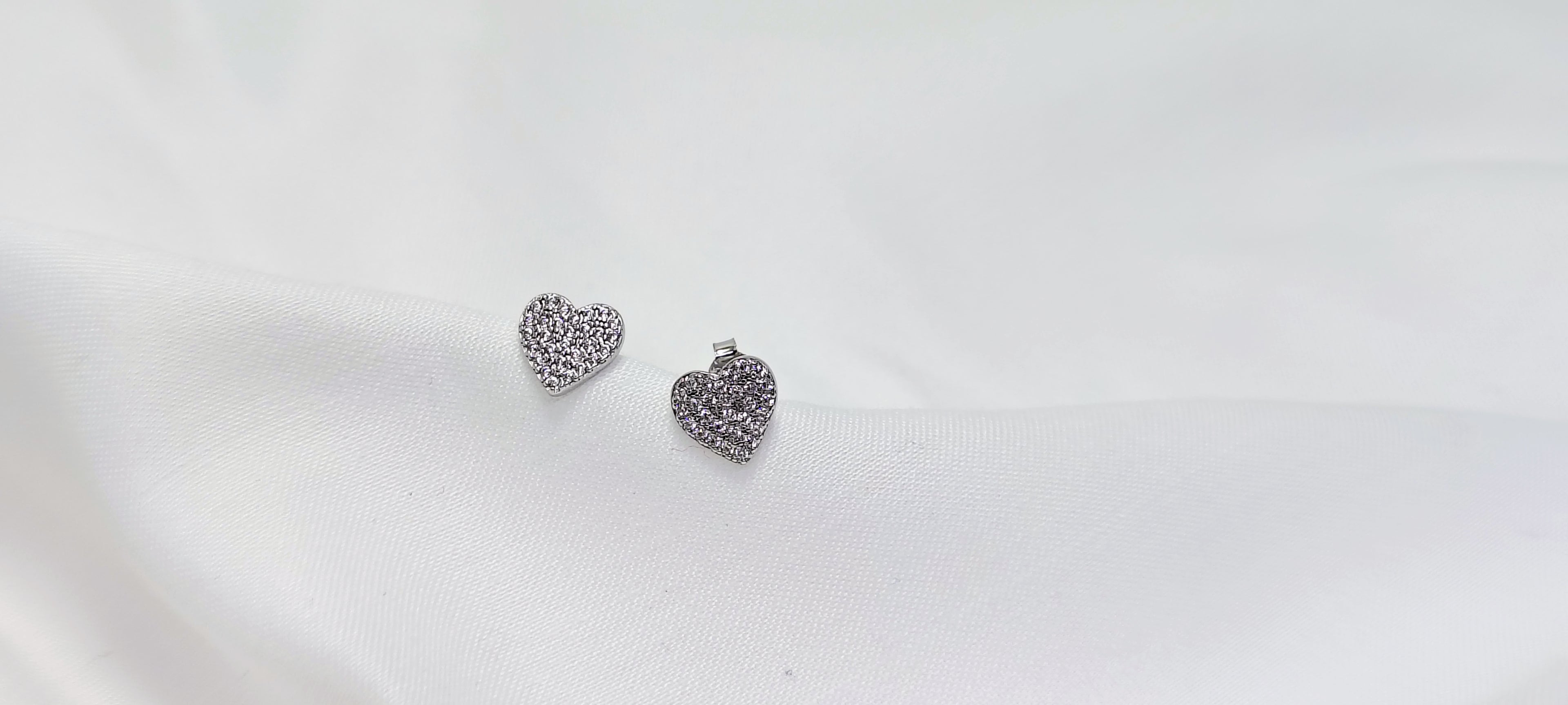 Silver Heart Shape Stud Earrings - Designed to catch the light — and the attention.