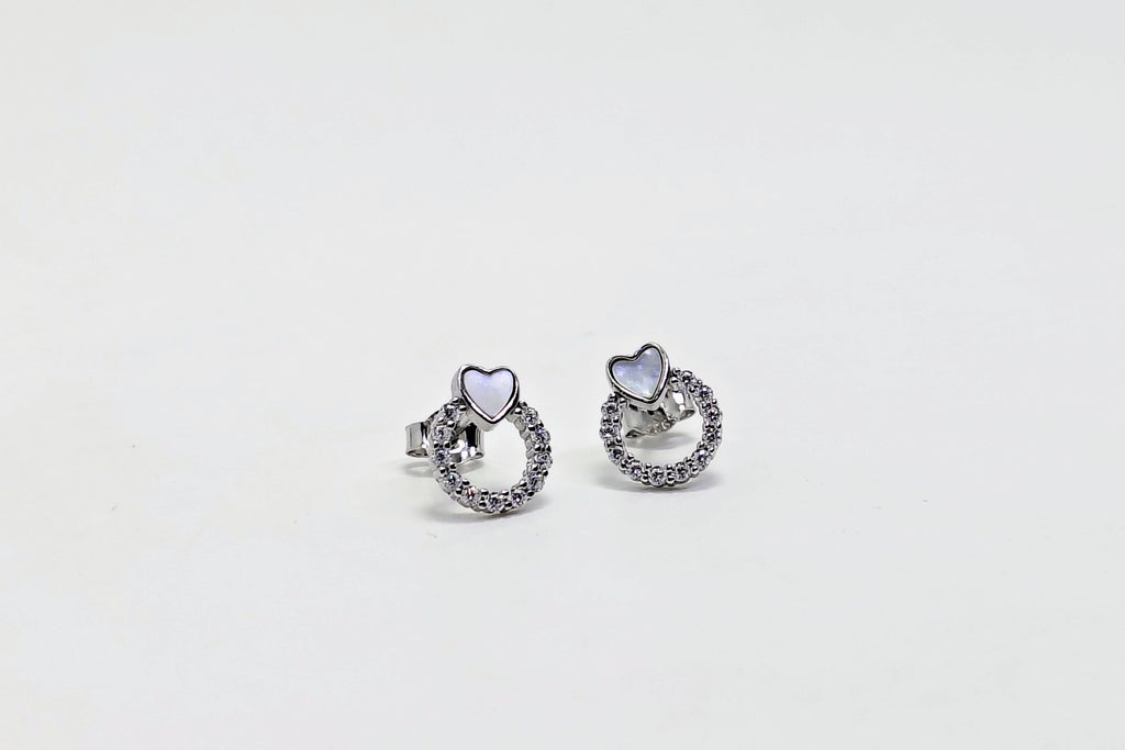 Pair of silver earrings with gemstones on a white background