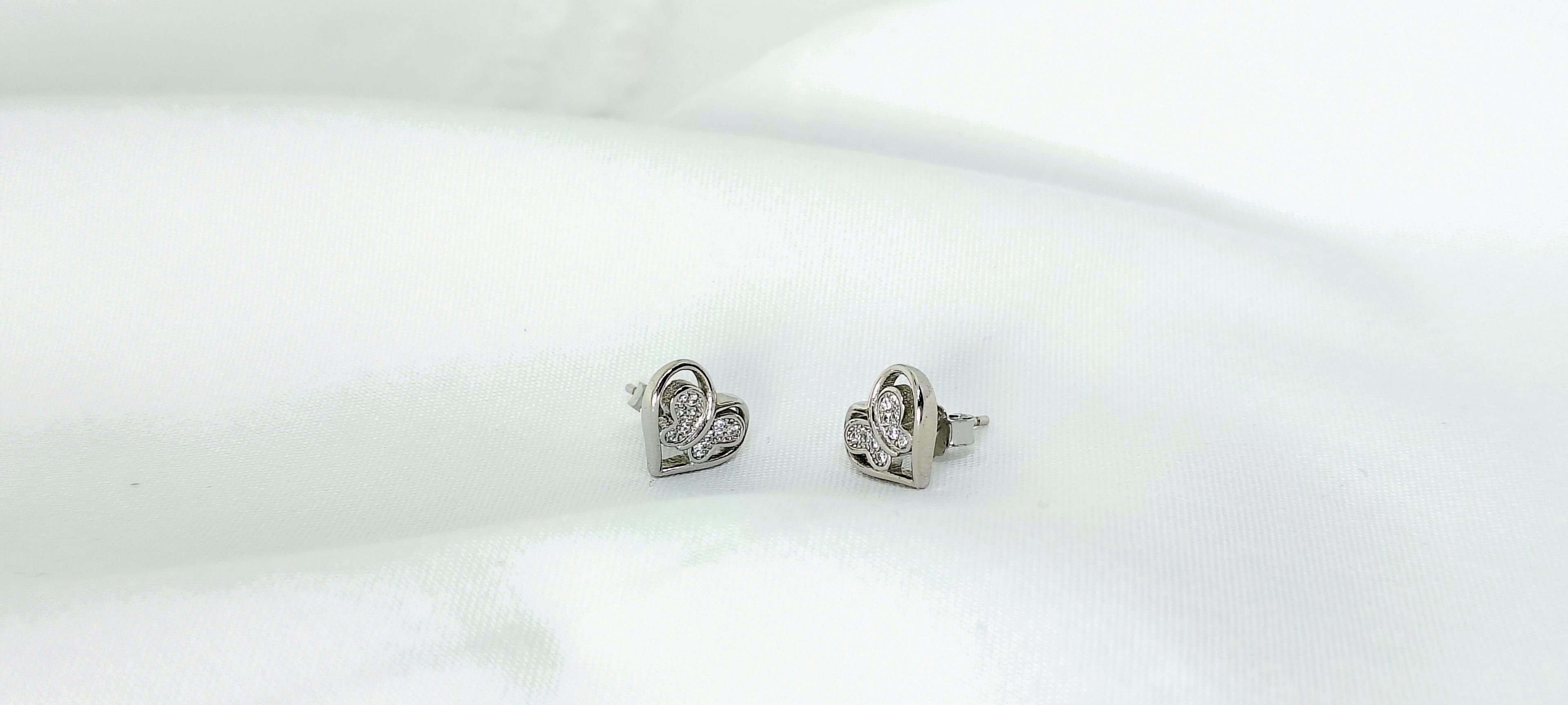 Silver Heart and Butterfly Everyday Stud Earrings - Designed to catch the light — and the attention.