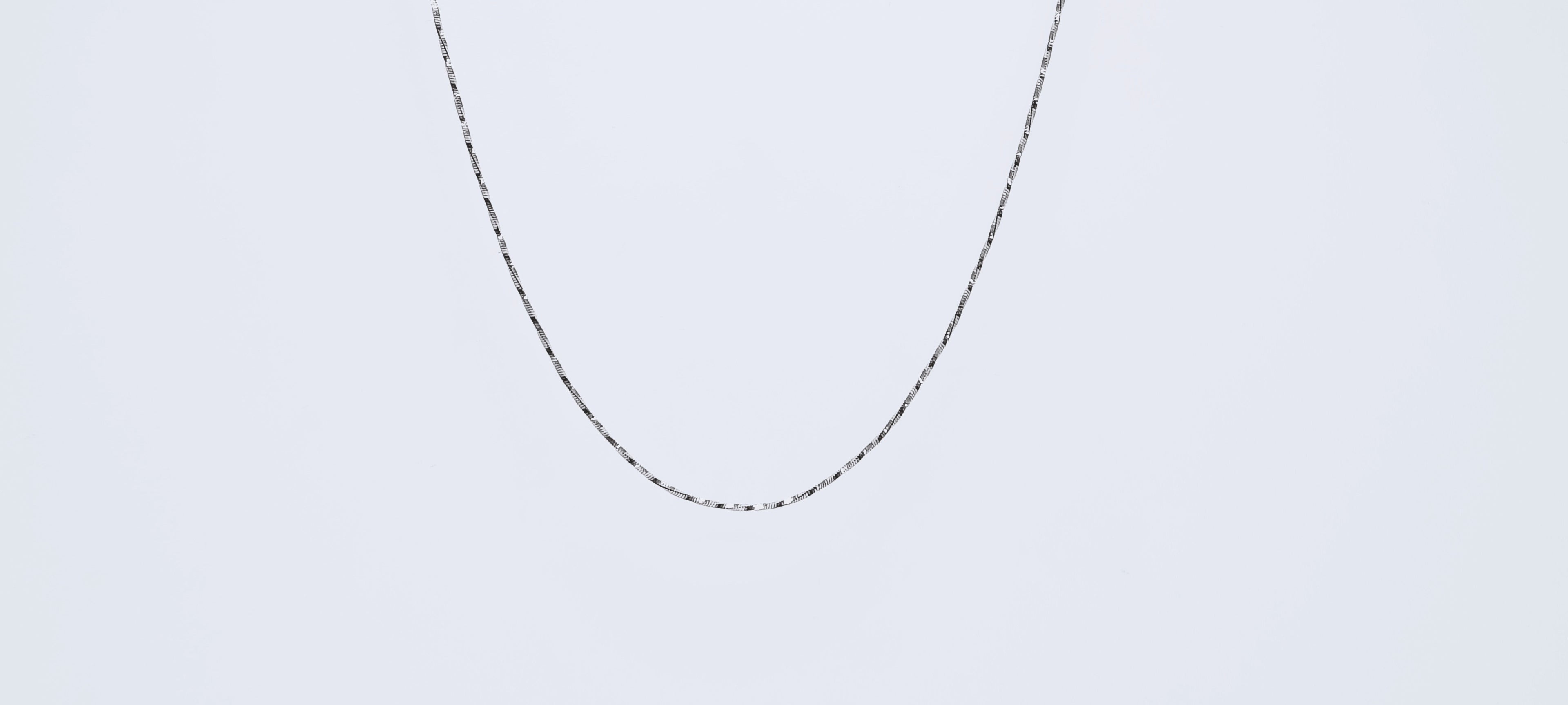 Elegant Everyday Twisted Silver Chain - When the lights dim and the music rises, this piece catches every glow.