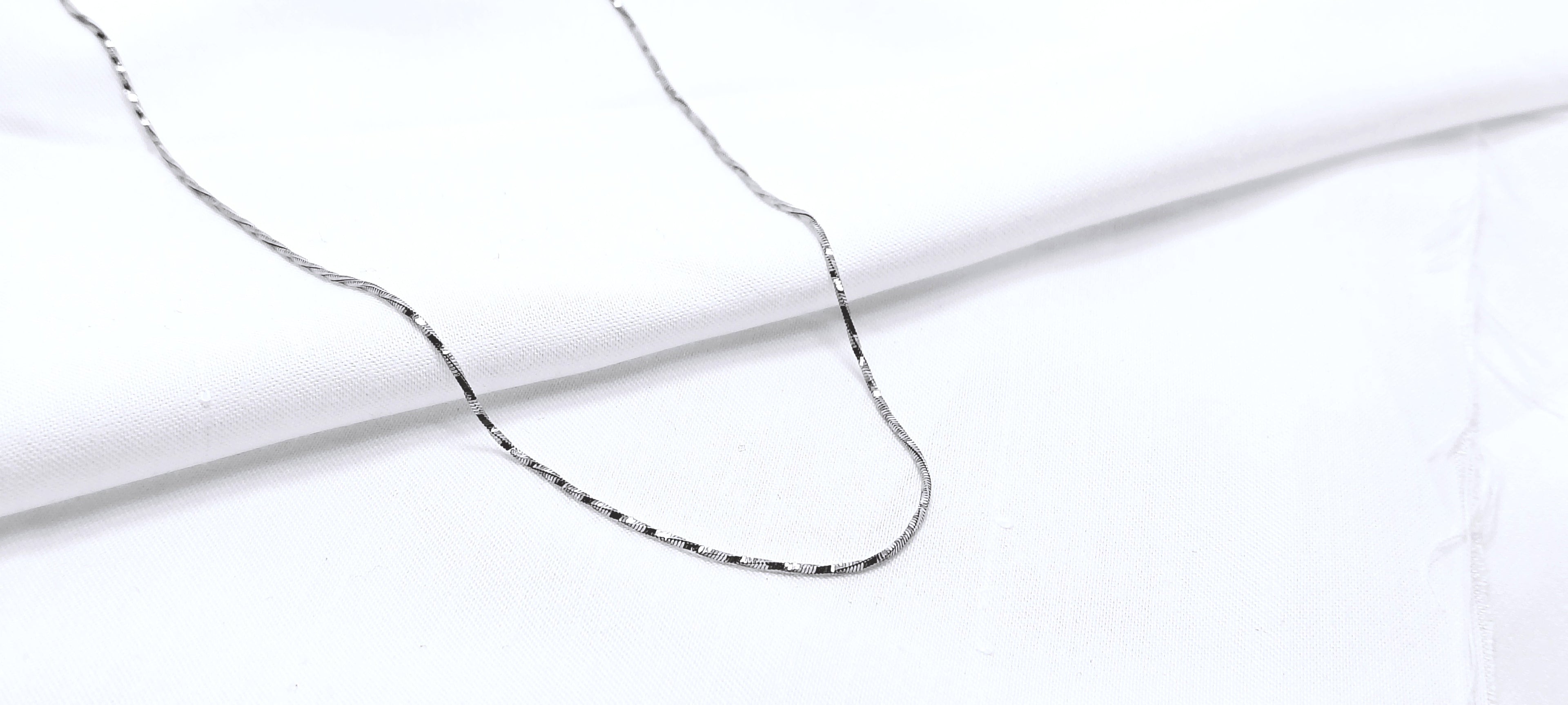 Elegant Everyday Twisted Silver Chain - When the lights dim and the music rises, this piece catches every glow.